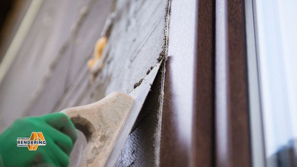 Applying render with green gloved hand