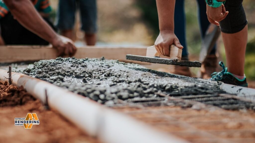 Smoothing fresh concrete with trowel